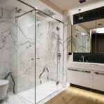 Apartment-in-Nowe-Powisle-Grey-vines-marble-shower-and-wood-floor