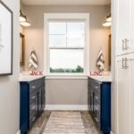 jack-and-jill-bathroom-with-blue-cabinets