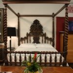 Wood-canopy-bed-frame-with-a-fancy-design
